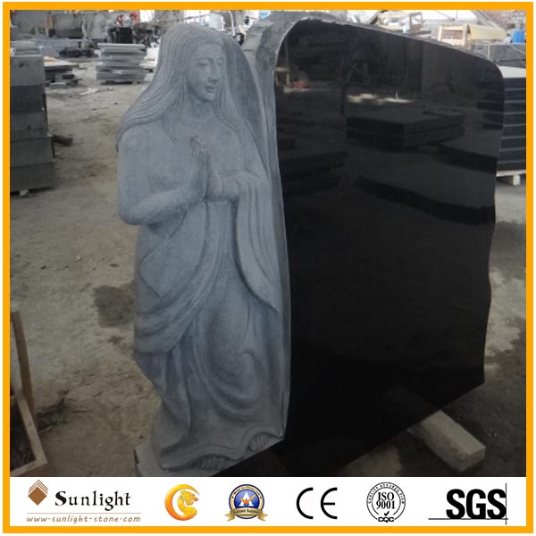 Absolute black tombstone with carving